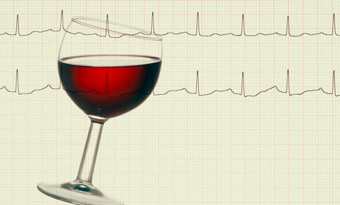 A tilted glass of red wine against the background of an electrocardiogram (ECG), which records the heart rate. 
