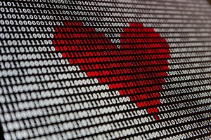 A sequence of binary numbers (1 and 0) on a black background forming a red heart in the centre, symbolising the connection between technology and heart health.