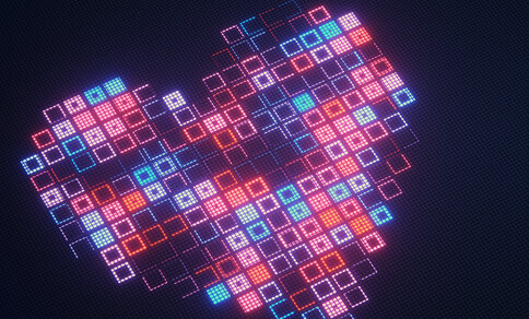 Digitale Illustration eines Herzens, zusammengesetzt aus zahlreichen leuchtenden quadratischen Pixeln in Rot-, Pink-, Orange-, Türkis- und Blautönen vor dunklem Hintergrund.