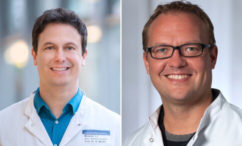  On the left, a man in a white doctor's coat (it is Prof Dr Benjamin Meder) smiles in a friendly manner. On the right, a man in a white doctor's coat (it is Dr Johannes Trebing) smiles in a friendly manner.